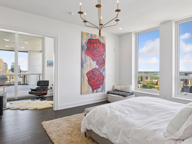 1111 River Pkwy Unit 33A, Minneapolis, MN 55415 - bedroom with multiple windows, wood finished floors, baseboards, and recessed lighting