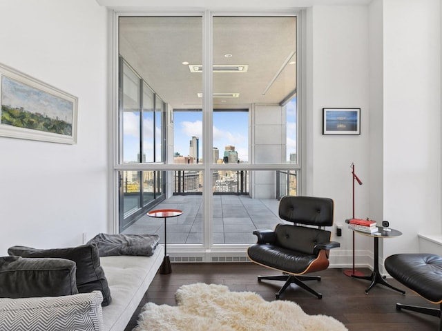1111 River Pkwy Unit 33A, Minneapolis, MN 55415 - sitting room featuring floor to ceiling windows, hardwood / wood-style flooring, and plenty of natural light