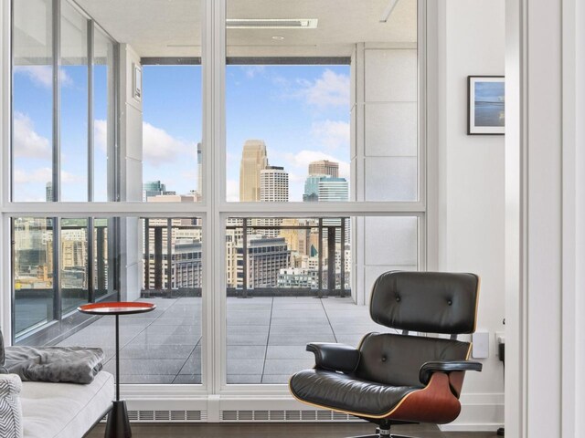 1111 River Pkwy Unit 33A, Minneapolis, MN 55415 - sitting room with a wall of windows and a skyline view