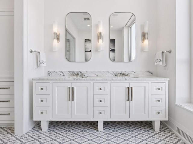 1111 River Pkwy Unit 33A, Minneapolis, MN 55415 - bathroom with double vanity and baseboards