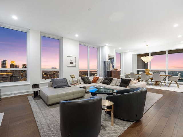 1111 River Pkwy Unit 33A, Minneapolis, MN 55415 - living room with floor to ceiling windows, dark wood-style floors, healthy amount of natural light, recessed lighting, and a chandelier