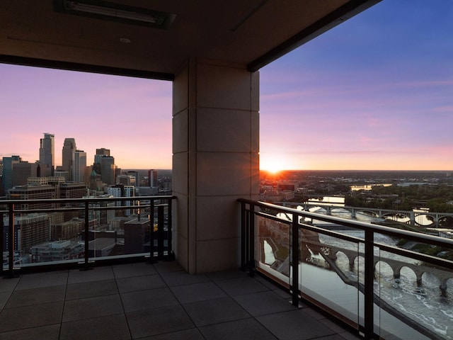 1111 River Pkwy Unit 33A, Minneapolis, MN 55415 - balcony at dusk with a view of skyline