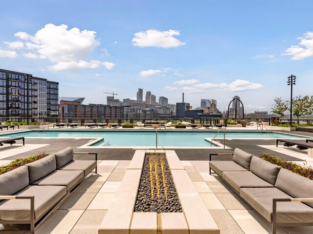 1111 River Pkwy Unit 33A, Minneapolis, MN 55415 - community pool with an outdoor living space, a patio area, and a skyline view