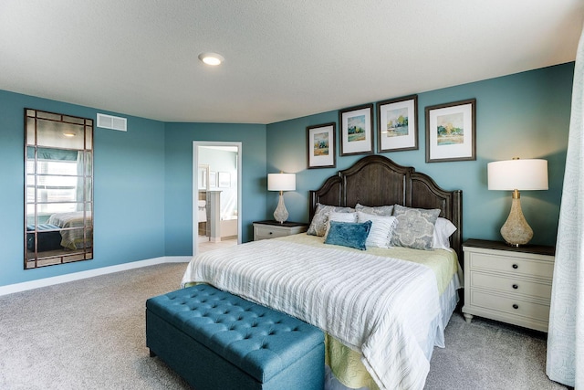 17090 Dimension Ave, Lakeville, MN 55044 - carpeted bedroom featuring baseboards, connected bathroom, and a textured ceiling