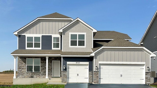 17090 Dimension Ave, Lakeville, MN 55044 - craftsman-style home with stone siding, board and batten siding, and driveway