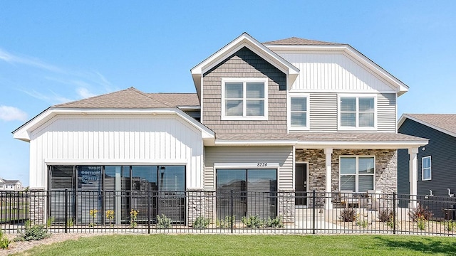 17090 Dimension Ave, Lakeville, MN 55044 - view of front facade with fence, stone siding, and covered porch