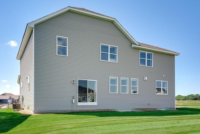 17090 Dimension Ave, Lakeville, MN 55044 - back of house with a lawn and cooling unit