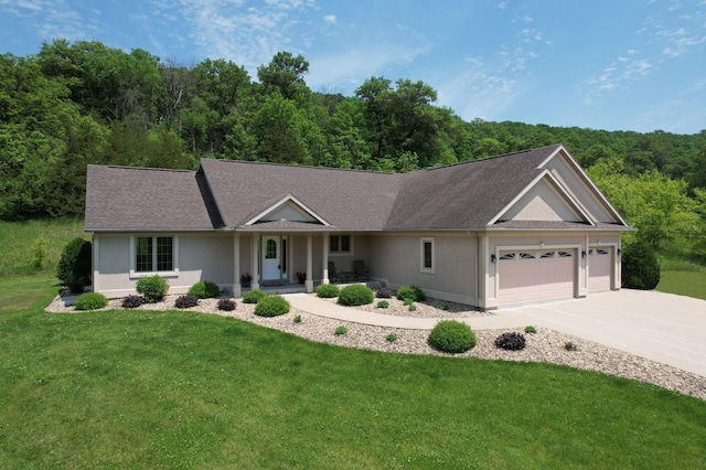 9484 Branch Rd SE, Chatfield, MN 55923 - ranch-style house with a garage, concrete driveway, a front lawn, covered porch, and stucco siding
