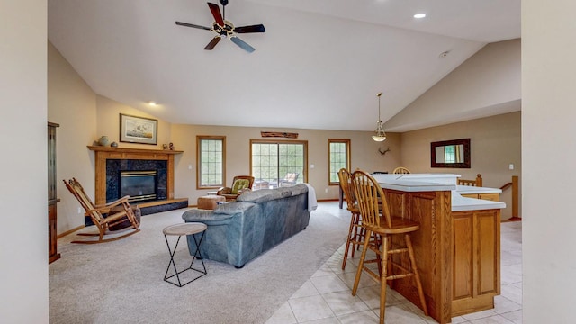 9484 Branch Rd SE, Chatfield, MN 55923 - living room featuring light carpet, light tile patterned flooring, a high end fireplace, a ceiling fan, and baseboards