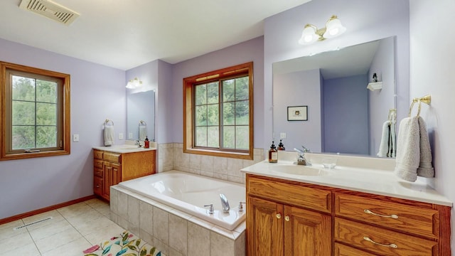 9484 Branch Rd SE, Chatfield, MN 55923 - bathroom with two vanities, a garden tub, tile patterned flooring, and baseboards