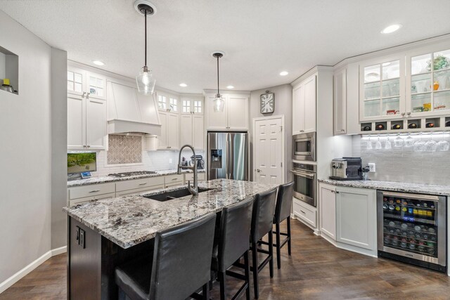 18764 Farmstead Cir, Eden Prairie, MN 55347 - kitchen featuring beverage cooler, stainless steel appliances, custom exhaust hood, a sink, and tasteful backsplash