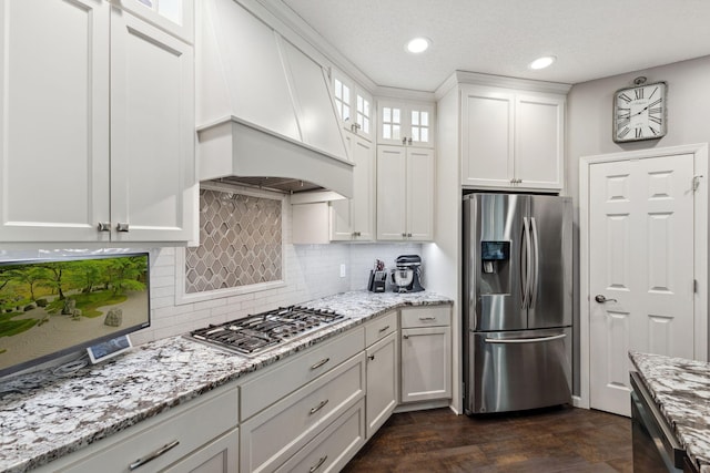 18764 Farmstead Cir, Eden Prairie, MN 55347 - kitchen with stainless steel appliances, white cabinetry, glass insert cabinets, decorative backsplash, and light stone counters