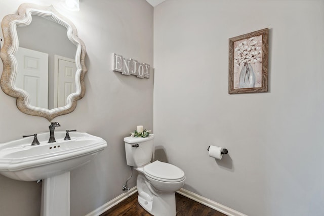 18764 Farmstead Cir, Eden Prairie, MN 55347 - bathroom featuring toilet, baseboards, and wood finished floors