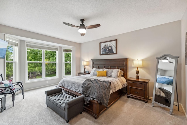 18764 Farmstead Cir, Eden Prairie, MN 55347 - bedroom featuring light carpet, baseboards, a ceiling fan, and a textured ceiling