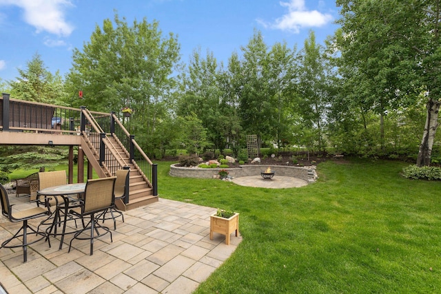 18764 Farmstead Cir, Eden Prairie, MN 55347 - view of green lawn featuring stairs, a fire pit, a patio area, a deck, and view of scattered trees