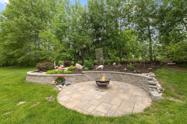 18764 Farmstead Cir, Eden Prairie, MN 55347 - view of grassy yard featuring an outdoor fire pit and a patio area