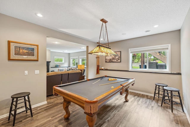18764 Farmstead Cir, Eden Prairie, MN 55347 - game room with baseboards, healthy amount of natural light, wood finished floors, recessed lighting, and a textured ceiling