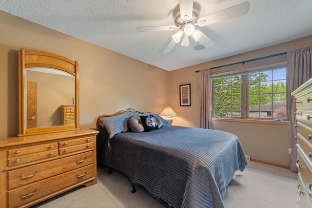 4975 Maribe Dr, Hermantown, MN 55811 - bedroom featuring light colored carpet, baseboards, a ceiling fan, and a textured ceiling