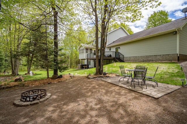 4975 Maribe Dr, Hermantown, MN 55811 - view of patio featuring a fire pit, stairs, and a wooden deck