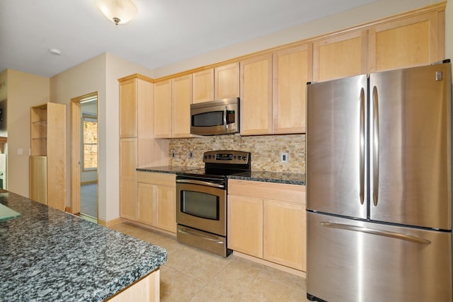 630 Main St N Unit 203, Stillwater, MN 55082 - kitchen with stainless steel appliances, light brown cabinets, and light tile patterned floors