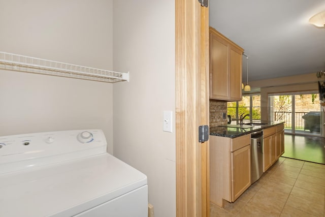 630 Main St N Unit 203, Stillwater, MN 55082 - laundry area with washer / clothes dryer and light tile patterned flooring