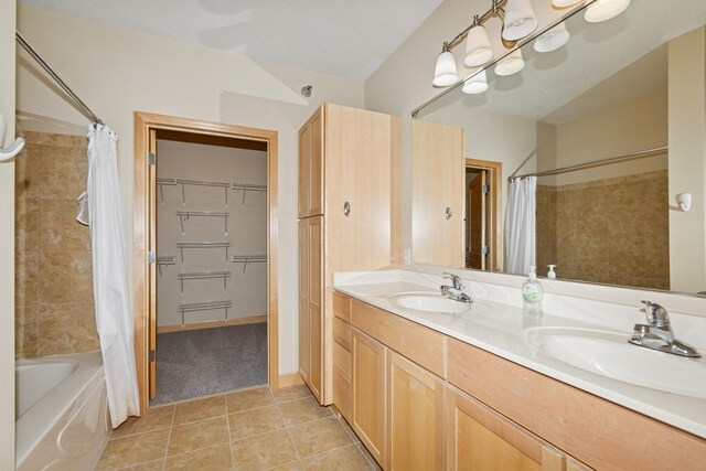 630 Main St N Unit 203, Stillwater, MN 55082 - bathroom with tile patterned floors, shower / tub combo with curtain, and double vanity