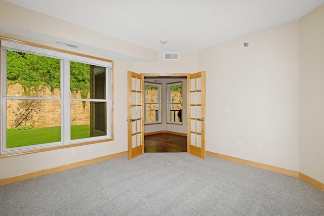 630 Main St N Unit 203, Stillwater, MN 55082 - carpeted empty room with french doors and baseboards