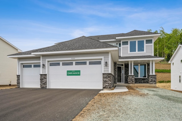 7353 Auburn Ln, Inver Grove Heights, MN 55077 - prairie-style home featuring stone siding, driveway, and a garage