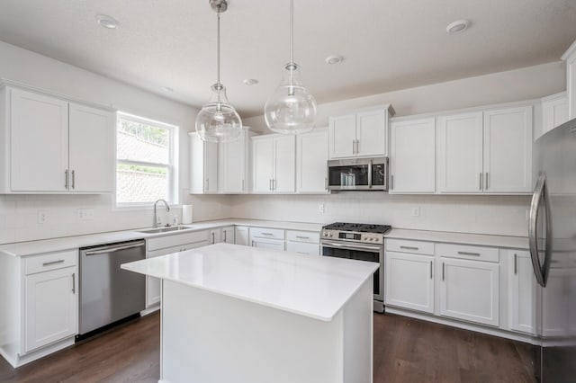 7353 Auburn Ln, Inver Grove Heights, MN 55077 - kitchen featuring stainless steel appliances, a sink, white cabinets, and light countertops