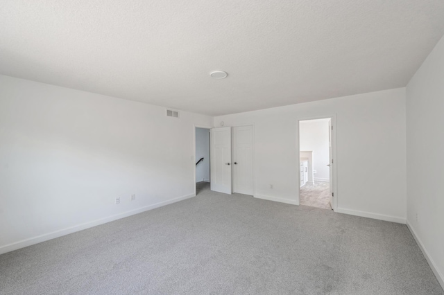 7353 Auburn Ln, Inver Grove Heights, MN 55077 - unfurnished bedroom featuring light carpet and baseboards