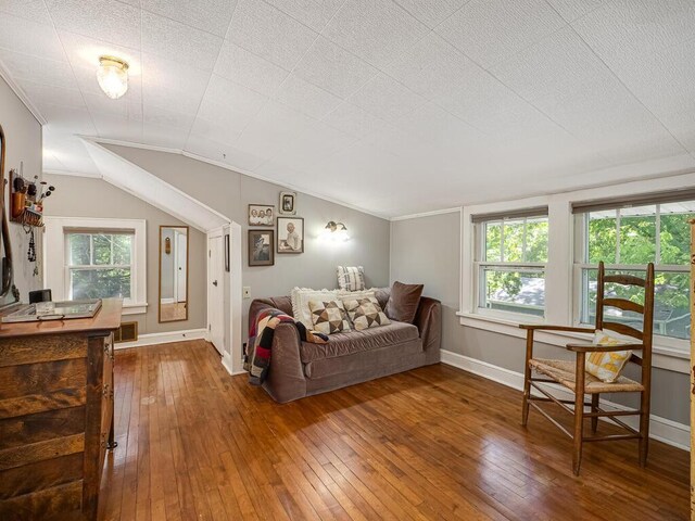 15210 Mckenzie Blvd, Minnetonka, MN 55345 - living room with hardwood / wood-style flooring, baseboards, vaulted ceiling, and ornamental molding