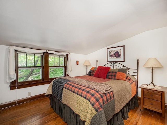 15210 Mckenzie Blvd, Minnetonka, MN 55345 - bedroom featuring hardwood / wood-style flooring, vaulted ceiling, and baseboards