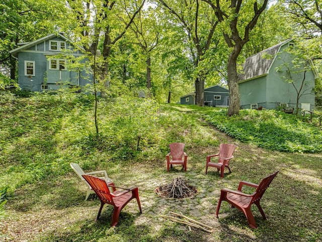 15210 Mckenzie Blvd, Minnetonka, MN 55345 - view of yard with an outdoor fire pit