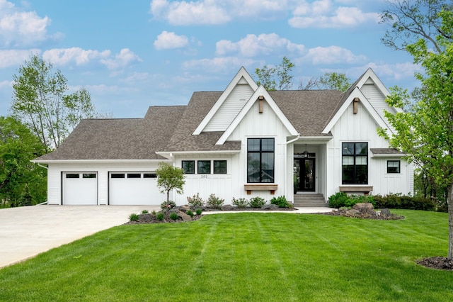 202 176th Ln NE, Ham Lake, MN 55304 - modern farmhouse featuring board and batten siding, driveway, a garage, a front lawn, and a shingled roof