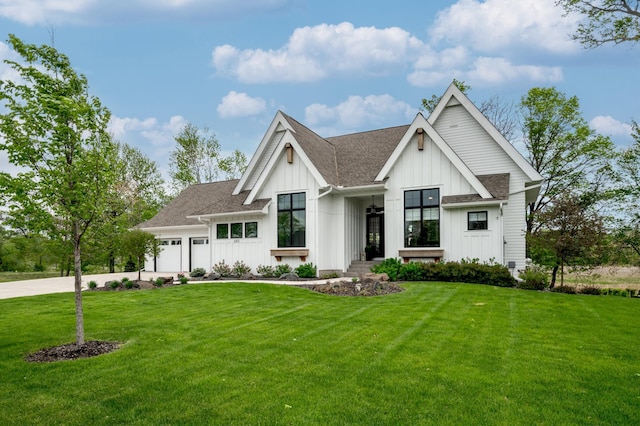 202 176th Ln NE, Ham Lake, MN 55304 - modern farmhouse featuring board and batten siding, a garage, a front yard, a shingled roof, and driveway