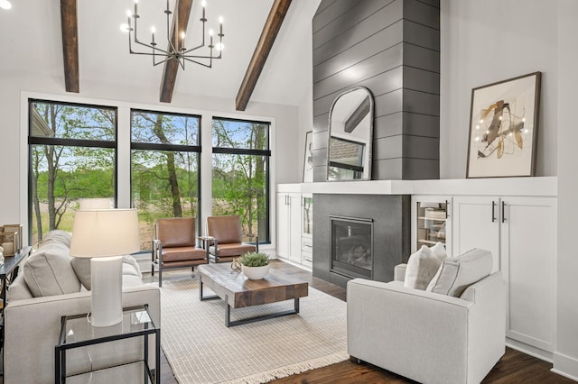 202 176th Ln NE, Ham Lake, MN 55304 - living room with a chandelier, dark wood finished floors, beamed ceiling, high vaulted ceiling, and a glass covered fireplace