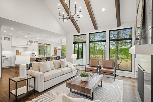 202 176th Ln NE, Ham Lake, MN 55304 - living area with high vaulted ceiling, a chandelier, recessed lighting, dark wood-style flooring, and healthy amount of natural light