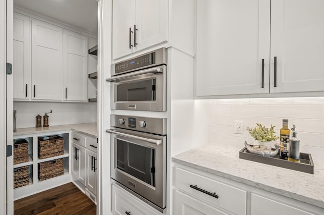 202 176th Ln NE, Ham Lake, MN 55304 - kitchen with white cabinetry, tasteful backsplash, and double oven