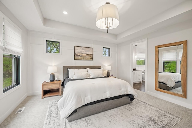 202 176th Ln NE, Ham Lake, MN 55304 - carpeted bedroom with multiple windows, a raised ceiling, baseboards, and recessed lighting