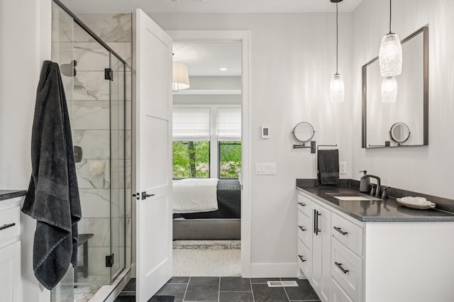 202 176th Ln NE, Ham Lake, MN 55304 - bathroom with vanity, a stall shower, tile patterned floors, and ensuite bathroom