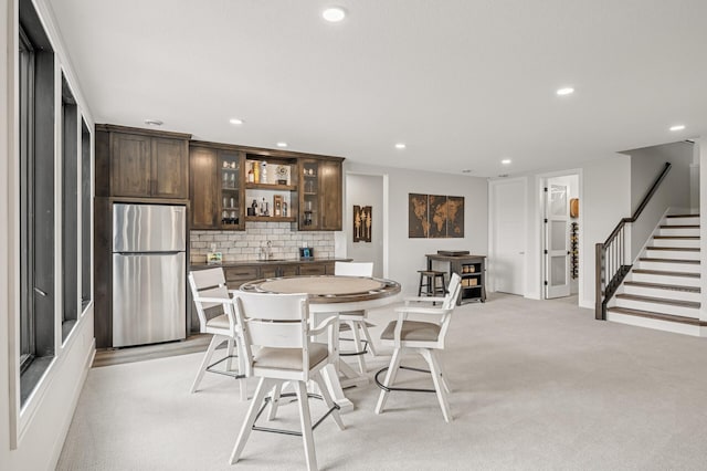 202 176th Ln NE, Ham Lake, MN 55304 - dining space with recessed lighting, stairway, and bar