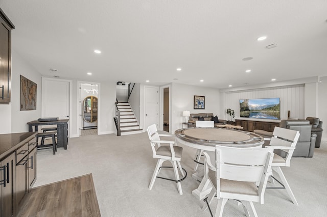 202 176th Ln NE, Ham Lake, MN 55304 - dining area featuring light colored carpet, stairway, and recessed lighting