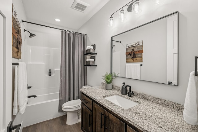 202 176th Ln NE, Ham Lake, MN 55304 - full bath featuring wood finished floors, toilet, vanity, and shower / bath combination with curtain