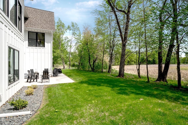 202 176th Ln NE, Ham Lake, MN 55304 - view of grassy yard featuring a patio area