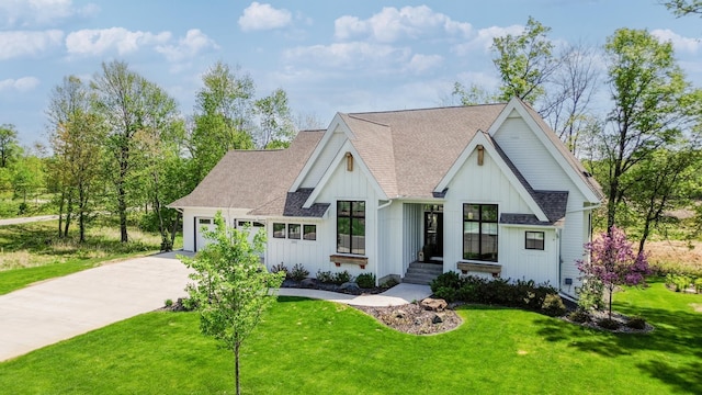 202 176th Ln NE, Ham Lake, MN 55304 - modern inspired farmhouse with board and batten siding, driveway, roof with shingles, a garage, and a front yard