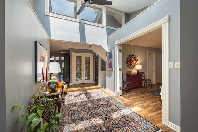 2513 Aspen Ln SW, Rochester, MN 55902 - entryway with wood finished floors, a ceiling fan, and a high ceiling