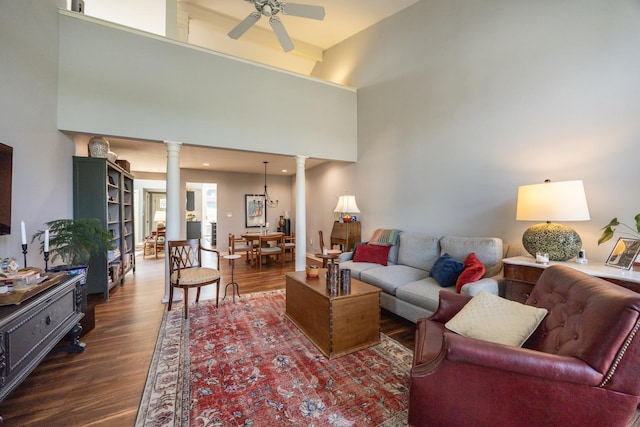 2513 Aspen Ln SW, Rochester, MN 55902 - living room with decorative columns, dark wood finished floors, ceiling fan, and a towering ceiling