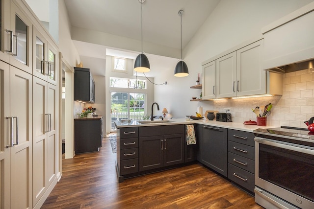 2513 Aspen Ln SW, Rochester, MN 55902 - kitchen with stainless steel electric stove, a sink, open shelves, a peninsula, and high vaulted ceiling