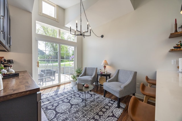 2513 Aspen Ln SW, Rochester, MN 55902 - sitting room with a chandelier, healthy amount of natural light, a towering ceiling, and wood finished floors
