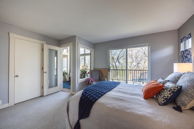 2513 Aspen Ln SW, Rochester, MN 55902 - carpeted bedroom with access to exterior and baseboards
